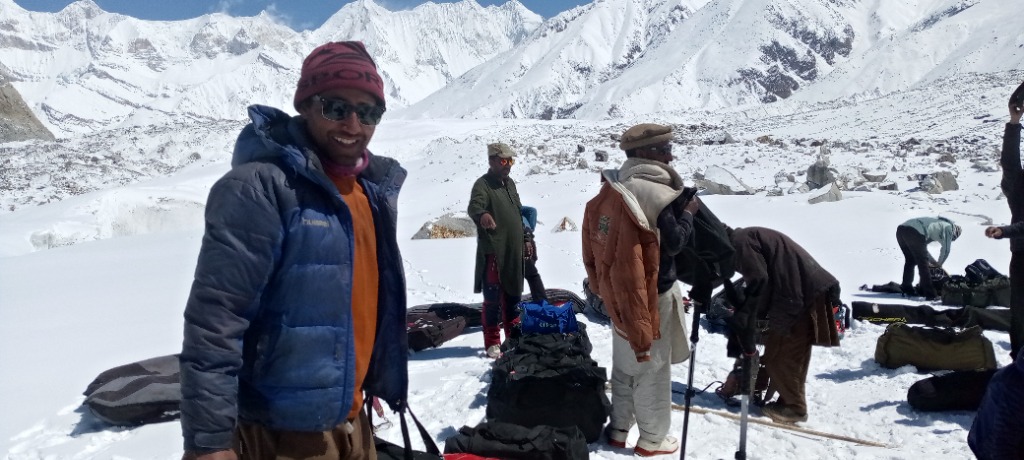 Namla Expeditions Lead Guide at K2 Base Camp with the Karakoram Mountain Range